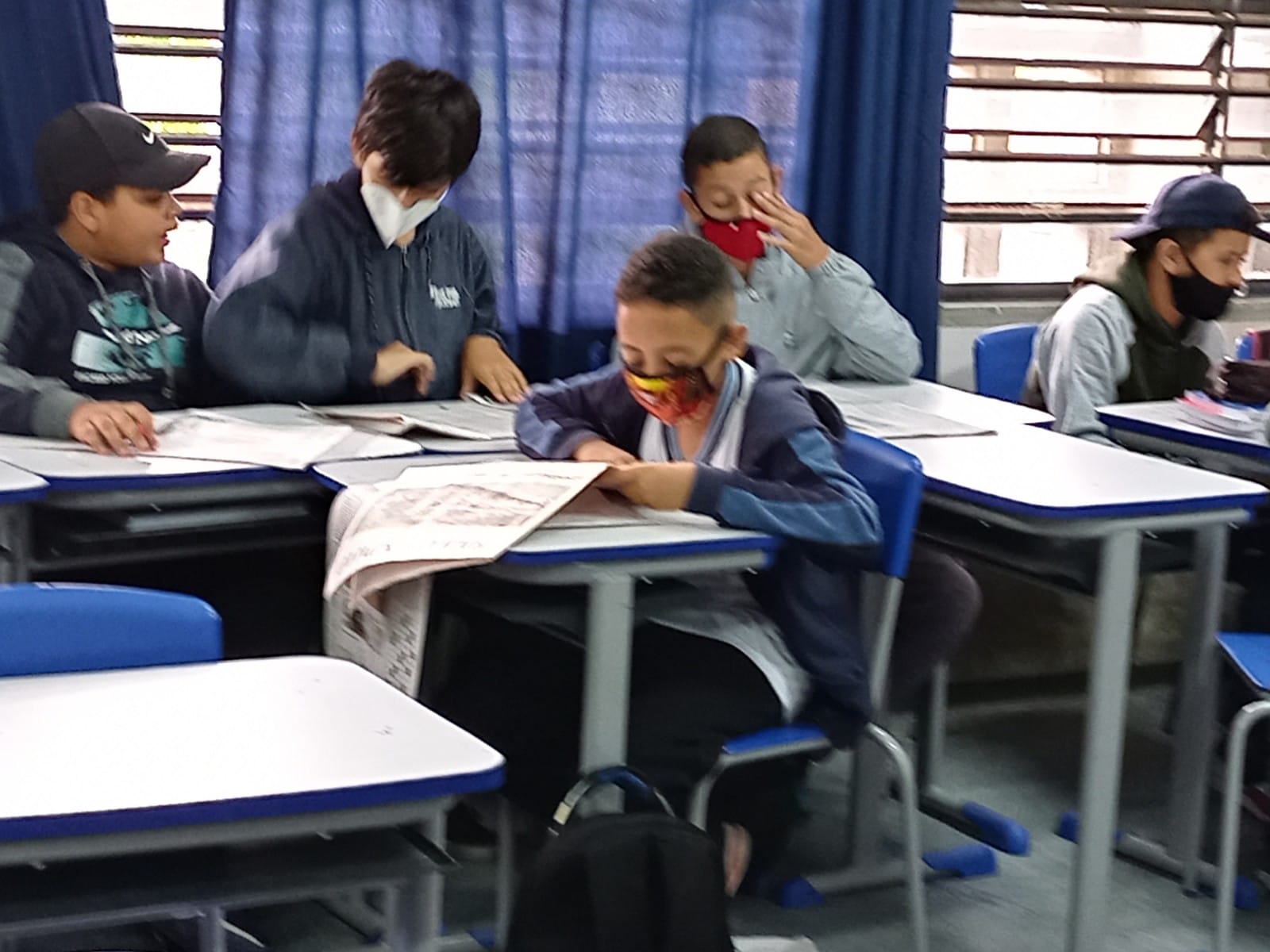 A generic square placeholder image with rounded corners in a figure.